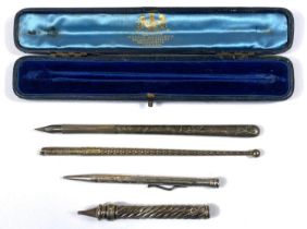 A cased silver ink dip fountain pen, another Art Nouveau and two pencils