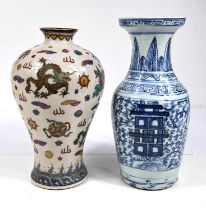 A modern Chinese dragon decorated vase with seal mark to base, height 23cm and a Chinese blue and