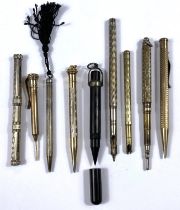 A selection of gilt and white metal propelling pencils