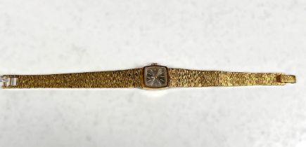 An OMEGA 1970's ladies cocktail watch, gilt bark effect strap