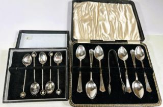 A hallmarked silver set of 6 teaspoons and tongs, boxed, Sheffield 1938; a part set of 5 coffee