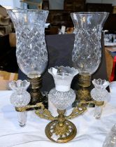 A pair of cut glass candle lamps of waisted form with metal columns, on marble bases, height 34cm; a