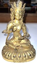 A Chinese gilded bronze buddha seated in lotus position, fine details, characters to the front,