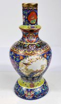 A 20th century Chinese vase brightly decorated with scrolling flowers and panels featuring birds,