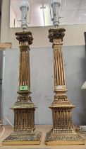 A large pair of square fluted brass Corinthian column table lamps