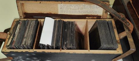 A selection of magic lantern slides in wooden box