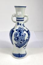 A Chinese blue and white vase decorated with domestic scenes, with animal hoop handles, a six