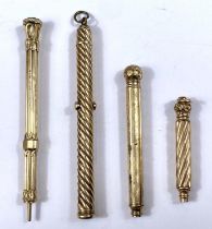 Four gilt propelling pencils, various forms one with agate seal top