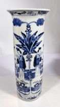 A large Chinese blue and white sleeve vase decorated with traditional domestic scene, four character