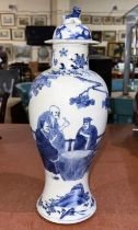 A 19th century Chinese blue and white vase decorated with domestic scenes plants and trees etc, with