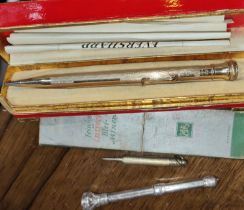 A selection of silver and gilt pencils etc