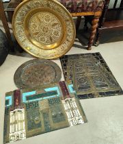 Two Middle Eastern brass panels depicting entrances with etched details and writing and a similar