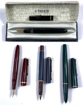 A cased Parker fountain pen and three other vintage Parker fountain pens