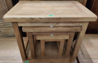 A modern light oak nest of 3 occasional tables