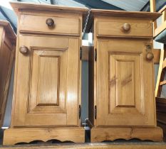 A pair of pine bedside cabinets; a pine framed free standing mirror