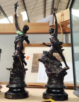 A pair of spelter French figures, on wooden plinths, height 49cm