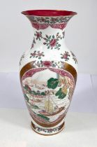 A Chinese famille rose vase decorated with oval panels of boats, gilt and floral decoration, six