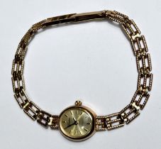 A 9ct hallmarked gold ladies wristwatch by Geneve with 9ct hallmarked chain strap, gross 9gm