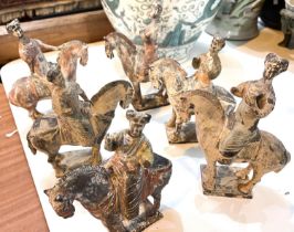 A group of Chinese terracotta figures on horse back on parade