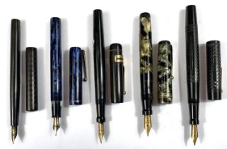 Five various vintage fountain pens, Swan etc with marble effect and other cases