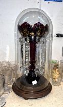 A Victorian Cranberry glass lustre under dome, height 39cm