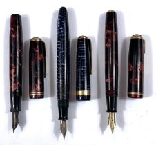 A vintage Parker Vacumatic fountain pen with pearlescent blue case, two coloured nib and two