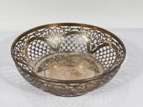 A hallmarked silver circular shallow bowl with pierced decoration, Sheffield 1918, diameter 19cm,