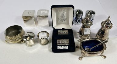 A hallmarked silver pair of travelling salt and pepper pots, boxed; silver plated cruets; etc.