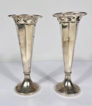 A hallmarked silver pair of specimen vases of tapering pierced form, on weighted bases, Birmingham