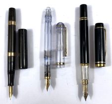 A Watermans vintage fountain pen with 9ct gold bands, another Watermans and another