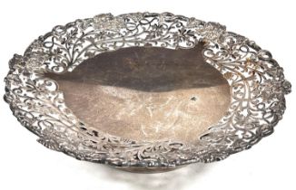 A hallmarked silver shallow pedestal dish with floral pierced border, on circular foot, Sheffield