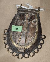 An African Benin bronze style purse with relief decoration