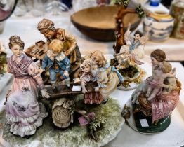 A Capodimonte group:  cobbler mending shoes, signed; other similar figures; etc.