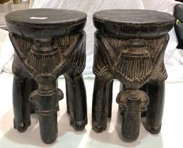 A pair of african carved stools in the form of elephants; and a vintage Rossman sewing machine.