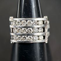 A gent's triple band white metal dress ring, each band set with 6 diamonds, approx 0.1 carat