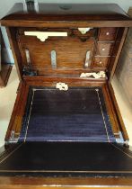 A 19th century golden oak cased writing box with fold out writing surface etc (with original