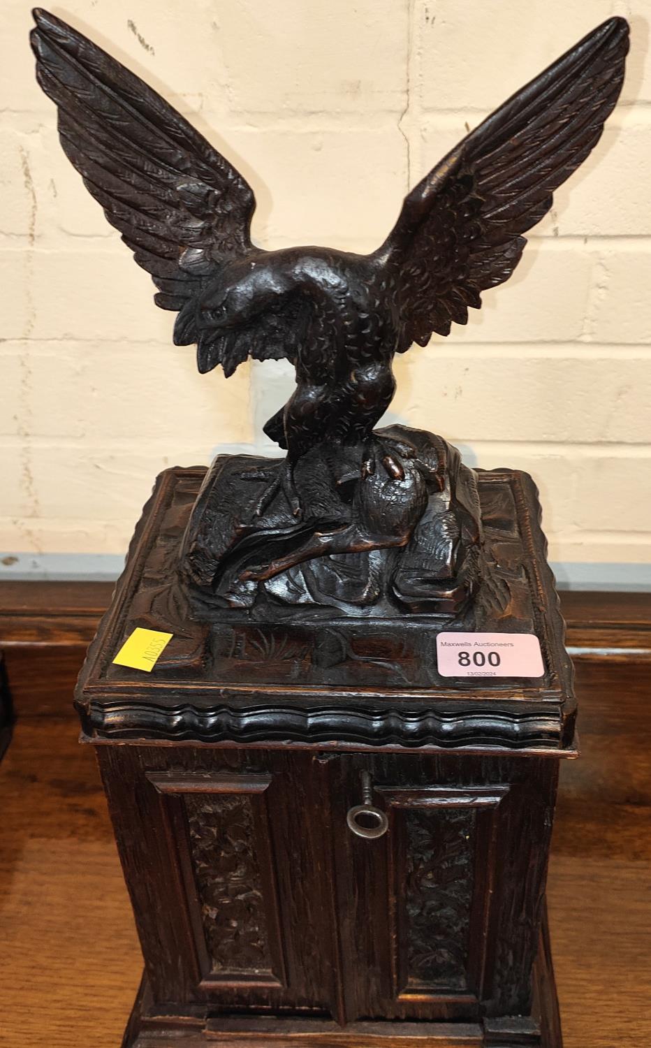 A 19th Black Forest carved cigar humidor in the form of eagle standing atop cupboard with double - Image 2 of 2