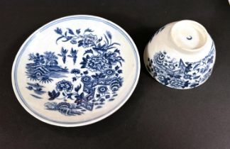 A First Period Worcester soft paste porcelain in blue and white tea bowl and saucer, garden scene,