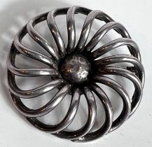 An Arts & Crafts large white metal brooch of circular form, diameter 6cm