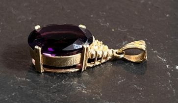 A 14 carat pendant set large amethyst coloured stone and cubic zirconia, 4.4gm