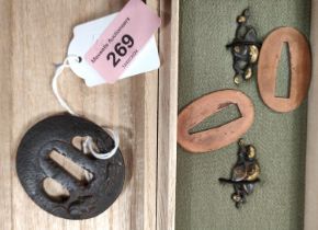 A Japanese Tsuba and other sword fittings in box