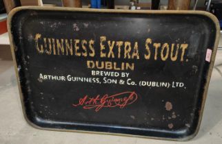 A large advertising cast metal pub tray painted with Guinness advertisement, length 67cm