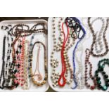 A selection of approx. 20 sets vintage bead necklaces including polished stones, crystal etc