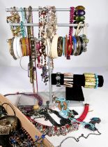 A large selection of modern costume jewellery containg bracelets, bangles and necklaces