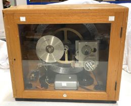 A 1960's school bell timer in glass cabinet