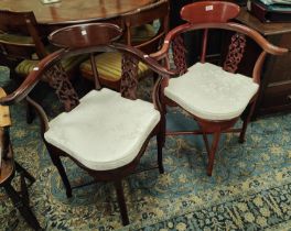 Two oriental hardwood corner armchairs