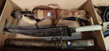 A North African Tuareg dagger in leather sheath, woven handle with metal end; another knife with