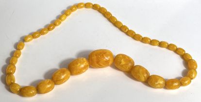 A vintage Bakelite type yellow bead necklace