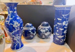 Two Chinese blue and white prunus ginger jars and two similar Chinese vases (a.f.)