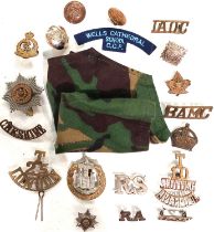 A collection of military cap badges, battens etc.